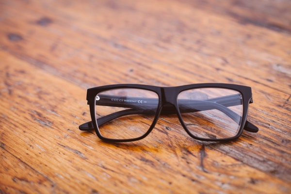 Black frame glasses on table