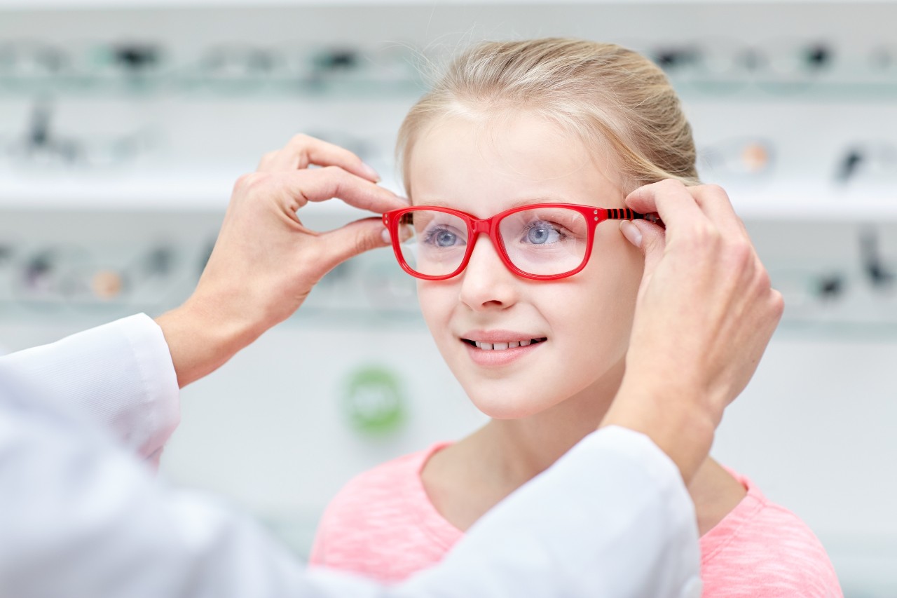 Girl trying on glasses