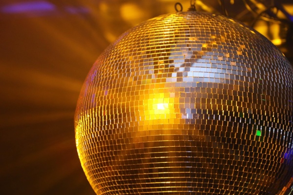 Disco ball with light reflecting off it.