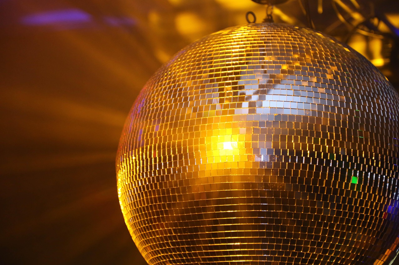 Disco ball with light reflecting off it.